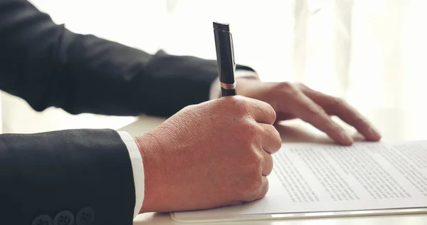 Asian business man using pen signing on new contract to starting projects in conference room. Close up manager businessman hands sign contract working meeting. Business agreement concepts.