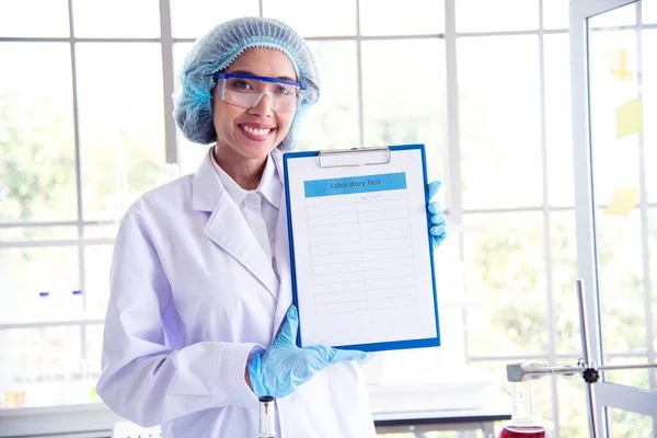 Portrait Asian women scientist laboratory background. female research pathologist clinician expert medical chemist. Woman expertise scientist portrait in medical lab. Happiness biology lab woman