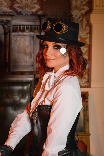 Steampunk girl In a white shirt leather corset hat round glasses