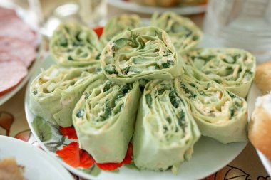 Dish. Sliced lavash roll with cucumber, cheese and dill