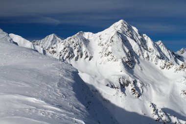 Mountains in intalian alps with small avalanche
