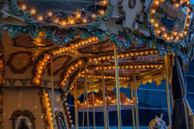 Carousel for kids with lights on in Barcelona