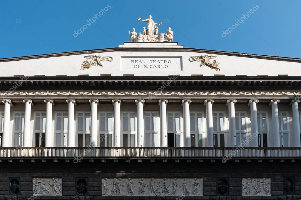 Naples, Italy. May 28, 2022. Top part of Real Teatro di San Carlo (Royal Theatre of Saint Charles) , an opera house in Naples, Italy with clear blue sky.