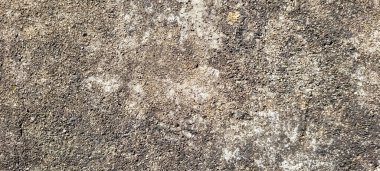 asfalt çimento ve yanmış taşların rustik dokusuna sahip koyu arkaplan