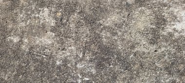 asfalt çimento ve yanmış taşların rustik dokusuna sahip koyu arkaplan