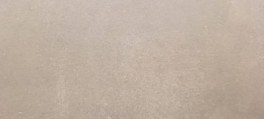 Soyut gri yanmış çimento döşeme desenli koyu renk arka plan panel üzerinde