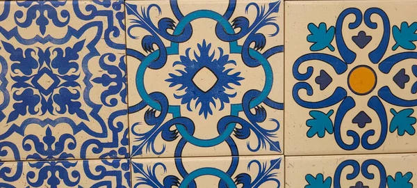 blue and white portuguese tile with drawings that can be used as a background