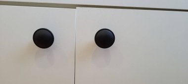 white furniture with black metal handle for room decoration