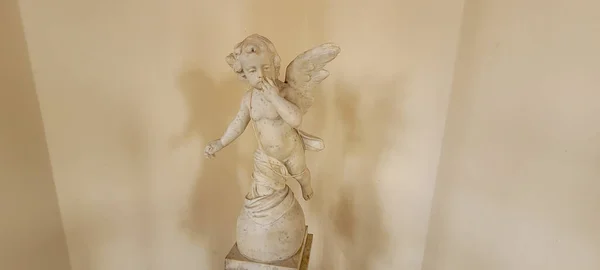 ancient white classic angel statue background from the portuguese empire