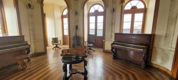 music room with classical piano violin and old cello in museum in the countryside of Brazil