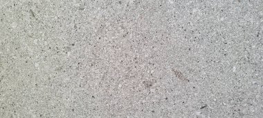 Soyut gri yanmış çimento döşeme desenli koyu renk arka plan panel üzerinde