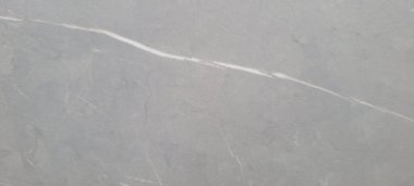 Soyut gri yanmış çimento döşeme desenli koyu renk arka plan panel üzerinde