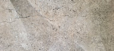 Soyut gri yanmış çimento döşeme desenli koyu renk arka plan panel üzerinde