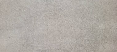 Soyut gri yanmış çimento döşeme desenli koyu renk arka plan panel üzerinde