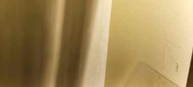 white curtain illuminated by sunlight used as a background