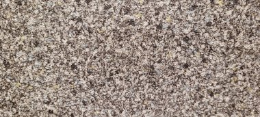 Soyut gri yanmış çimento döşeme desenli koyu renk arka plan panel üzerinde