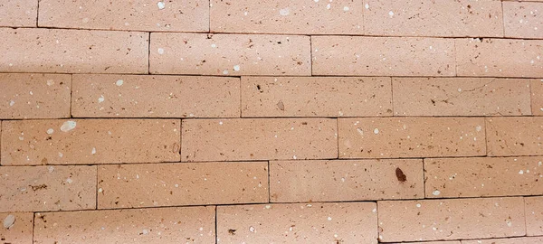 background of clay bricks in masonry wall of house in countryside of Brazil