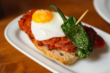 Pinchos with pimiento de Padrn and sobrasada, egg