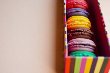 Macaroons packed in colorful box