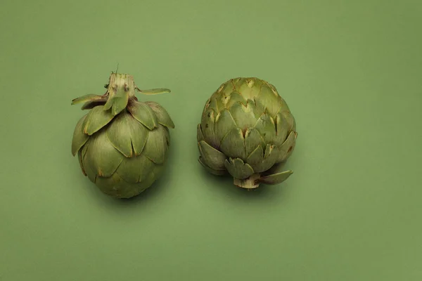 Fresh artichoke on green background. Two whole green artichokes mockup. — Stock Photo, Image