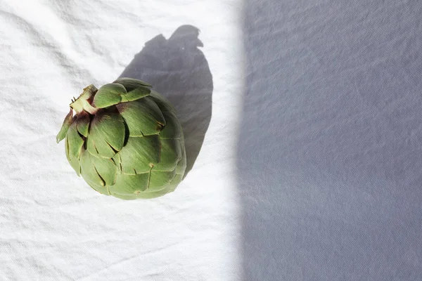 Fresh green artichoke on white. Whole raw artichoke mockup. Space for text. — Stock Photo, Image