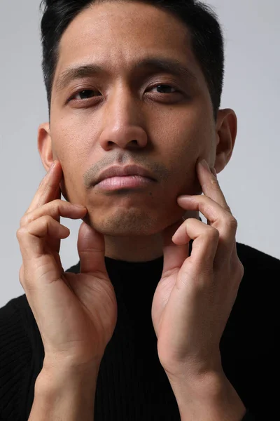 Vertical headshot of Asian man looking at the camera. Mental health issues. — 스톡 사진