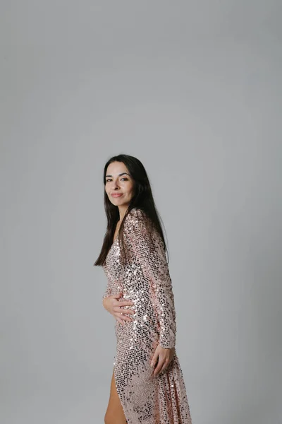 Portrait of middle-aged woman posing indoor with stylish long dress. Mock-up. High quality photo.