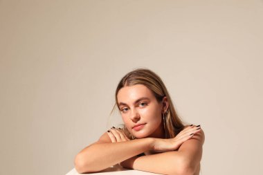 Portrait of young woman looking straight poses on white. Mental health. Mock-up. High quality photo.