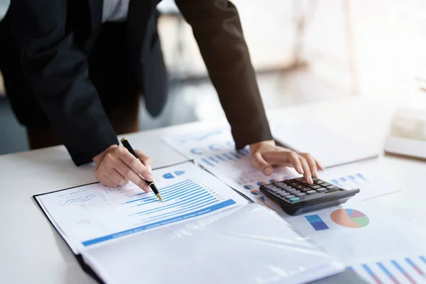 Data analysis, plan, marketing, accounting, audit, asian business woman holding pen of planning marketing using statistical data sheet and calculator to present marketing plan project at meeting. — Fotografia de Stock