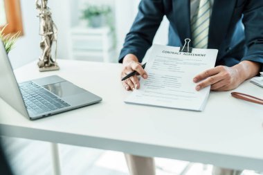 Law, Consultation, Agreement, Contract, Attorney or Lawyer holding a pen is consulting with a client to explain the pattern of answering questions before going to court to decide a lawsuit.