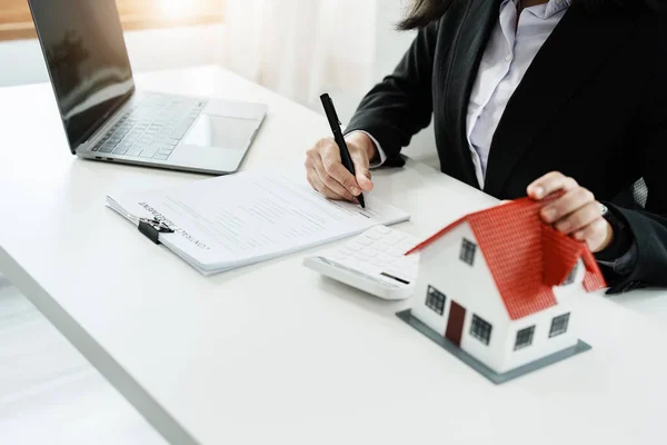Law, agreement, contract, mortgage, woman holding a pen, reading the contract document in buying a house to see the interest rate and asking for the limit to assess the risk before buying a house — Photo