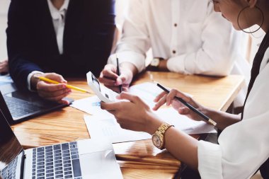 Start-up Business, a team of young entrepreneurs working together to increase profits into the company to increase business potential.