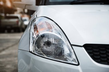 Inspection of car headlights and turn signals before leaving.