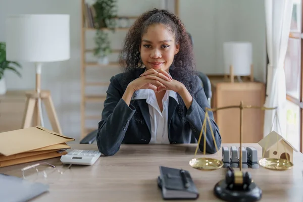 Portrait of a female lawyer, African Americans working at the office to study the case before litigation with the parties