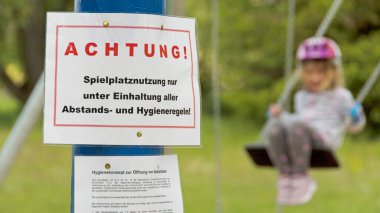 Playground with information (in German) about playground use due to coronavirus
