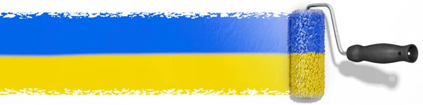 油漆滚筒把乌克兰国旗挂在墙上 — 图库照片