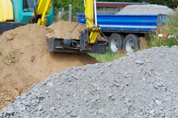 Soil Replacement Excavator Full Excavator Bucket Pile Crushed Rock Foreground Stock Photo