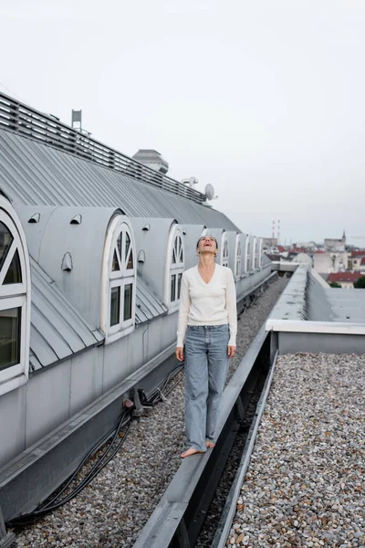 Full Length Amazed Woman Looking While Walking Barefoot Rooftop — 스톡 사진