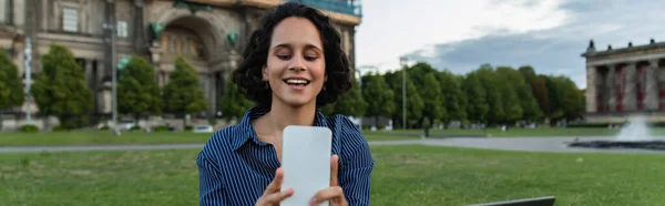 Cheerful woman taking selfie on smartphone near cathedral in berlin, banner — Fotografia de Stock