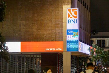 Jakarta, Indonesia - August 20, 2022: Jakarta business district with BNI building in front