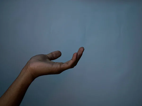 Open palm of a male hand gesture.Isolated on a white background.