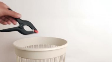 Construction clothespins are thrown away for disposal and recycling