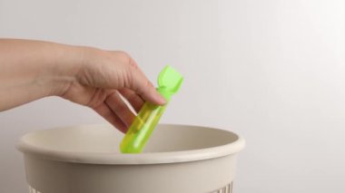 The plastic toy is thrown away for recycling and disposal