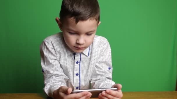 Cute Boy Holding Smartphone Looking Something Interesting — 비디오