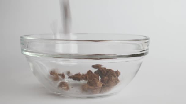 Granola Poured Transparent Bowl White Background Healthy Food — Vídeos de Stock