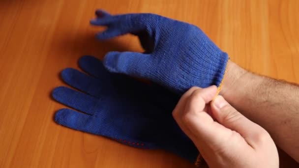 Man Puts Work Gloves Concept Special Work Clothes — Stockvideo