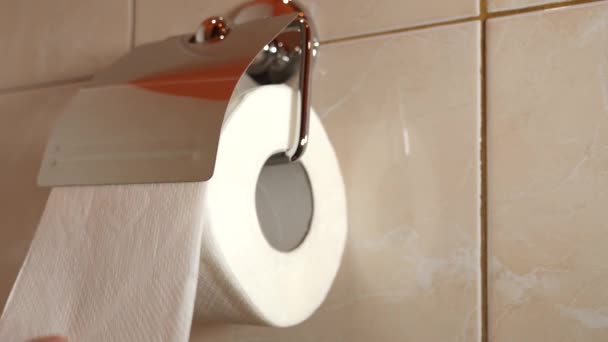 Man Unrolls Some Toilet Paper Holder Tears Concept Personal Hygiene — Stockvideo