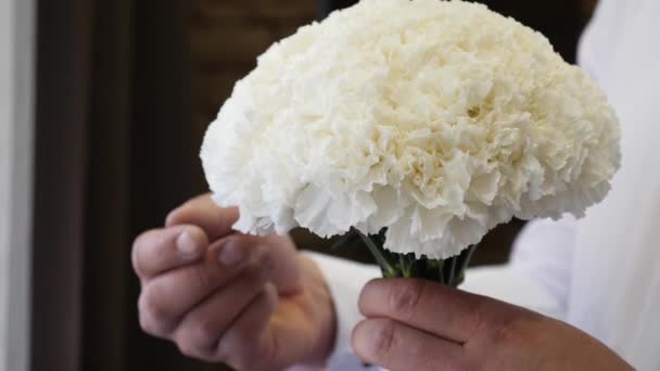 Man Touching His Fingers Examines Delicate White Bouquet Flowers — Wideo stockowe