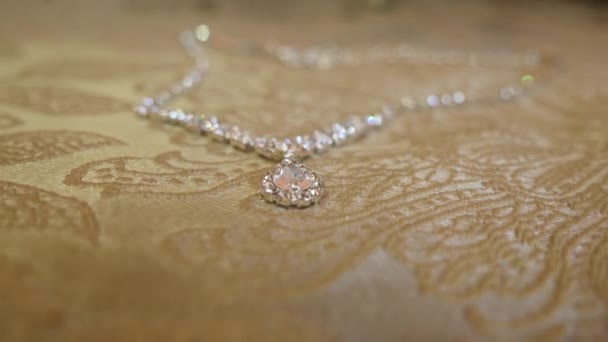 Beautiful Necklace Shiny Stones Beige Fabric Background — Stockvideo