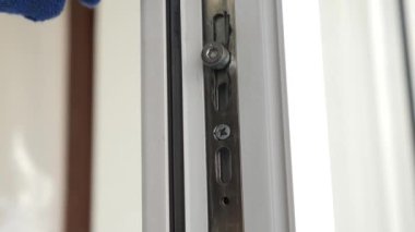 Lubrication of window fittings. Service, window care. Window service engineer.